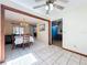Open-concept living space with dining area transitioning to a cozy seating area at 8346 Mattituck Cir, Orlando, FL 32829