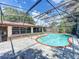 Screened pool with patio area perfect for outdoor relaxation and entertaining at 8346 Mattituck Cir, Orlando, FL 32829