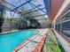 Escape to this screened-in pool with a brick-lined edge and patio, perfect for outdoor living and relaxation at 8346 Mattituck Cir, Orlando, FL 32829