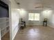 Cozy living room with sleek floors and plenty of natural light at 9148 Oakwood Dr, Lake Wales, FL 33898