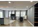 Open-concept living area with kitchen, dining space, and lots of natural light at 9148 Oakwood Dr, Lake Wales, FL 33898