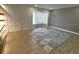 Bright living room featuring hardwood floors, large window, and a neutral color palette at 9148 Oakwood Dr, Lake Wales, FL 33898