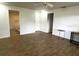 Open-concept living room with sleek floors, and access to other rooms at 9148 Oakwood Dr, Lake Wales, FL 33898
