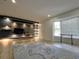 Open living space with light hardwood floors, custom shelving, and natural light at 9148 Oakwood Dr, Lake Wales, FL 33898