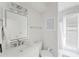 Bright, updated bathroom featuring a clean vanity, modern lighting, and access to the outdoors at 9285 Wickham Way, Orlando, FL 32836