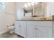 Bathroom with double sink vanity, neutral counter tops, and modern toilet at 9285 Wickham Way, Orlando, FL 32836