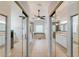 Bright and airy bathroom with dual vanities, a soaking tub, and a glass-enclosed shower at 9285 Wickham Way, Orlando, FL 32836