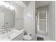 Clean and modern bathroom with a single vanity, neutral tones, and a walk-out door at 9285 Wickham Way, Orlando, FL 32836