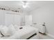 Bright bedroom with ceiling fan, closet, dresser, and bed at 9285 Wickham Way, Orlando, FL 32836