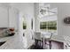 Charming breakfast nook with large windows, offering plenty of natural light and cozy seating at 9285 Wickham Way, Orlando, FL 32836