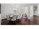 Elegant dining room with stylish chandelier, decor mirror, and comfortable seating for eight at 9285 Wickham Way, Orlando, FL 32836