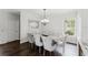 Elegant dining room with stylish chandelier, decor mirror, and comfortable seating for eight at 9285 Wickham Way, Orlando, FL 32836