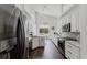 Spacious kitchen featuring stainless steel appliances, granite countertops, and ample cabinet space at 9285 Wickham Way, Orlando, FL 32836