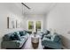Bright and spacious living room with a pool view, comfortable seating, and stylish decor at 9285 Wickham Way, Orlando, FL 32836