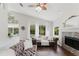 Comfortable seating with fireplace, bright with pool view in living room at 9285 Wickham Way, Orlando, FL 32836