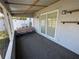 This enclosed patio area is great for relaxing with its tiled floors, neutral paint, and screened windows at 2315 Pembrook Dr, Orlando, FL 32810