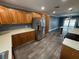 Well-equipped kitchen with wooden cabinets and stainless steel appliances with wood-look floors at 2315 Pembrook Dr, Orlando, FL 32810