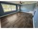 Bright living room with wood-look flooring, a ceiling fan, and ample natural light at 2315 Pembrook Dr, Orlando, FL 32810