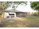 View of the back exterior of the home, featuring the screened in patio at 1005 Black Willow Dr, Oviedo, FL 32765