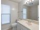 Bathroom featuring a vanity, mirror, and toilet at 1005 Black Willow Dr, Oviedo, FL 32765