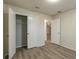 Bedroom with closet and wood-look floors and neutral paint at 1005 Black Willow Dr, Oviedo, FL 32765