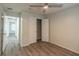 Bedroom featuring a ceiling fan, wood-look flooring, and closet with bi-fold doors at 1005 Black Willow Dr, Oviedo, FL 32765