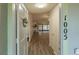 Welcoming foyer with wood-look floors leading to an open living area with backyard access at 1005 Black Willow Dr, Oviedo, FL 32765