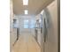 Functional kitchen featuring stainless steel appliances and bright white cabinets and tile floors at 1005 Black Willow Dr, Oviedo, FL 32765