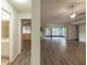 Open-concept living room with wood-look floors flowing into other areas of the home at 1005 Black Willow Dr, Oviedo, FL 32765