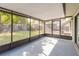 Spacious screened patio with view of fenced backyard at 1005 Black Willow Dr, Oviedo, FL 32765
