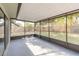 Enclosed back patio overlooking the backyard at 1005 Black Willow Dr, Oviedo, FL 32765