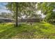 Private backyard offers a pool, patio space, and lush lawn for relaxing and entertaining at 111 Tarrytown Trl, Longwood, FL 32750