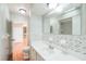 Bathroom featuring a toilet, single sink vanity and tile shower with a marbled accent at 111 Tarrytown Trl, Longwood, FL 32750