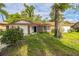 Charming single-story brick home with an attached garage and mature trees in a lush yard at 111 Tarrytown Trl, Longwood, FL 32750