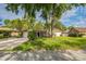 Home with mature trees in the front yard and an attached garage at 111 Tarrytown Trl, Longwood, FL 32750