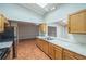 Spacious kitchen with granite countertops, ample wood cabinets, and open layout to living area at 111 Tarrytown Trl, Longwood, FL 32750