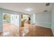 Spacious living room showcasing tiled floors, and connections to the kitchen and the sunroom at 111 Tarrytown Trl, Longwood, FL 32750