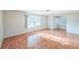 Bright living room with tile flooring and a large window offering ample natural light at 111 Tarrytown Trl, Longwood, FL 32750