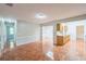 Open-concept living area with tiled flooring, and views into the kitchen and hallways at 111 Tarrytown Trl, Longwood, FL 32750