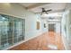 Bright sunroom with skylights, beamed ceilings, sliding glass doors and tile flooring at 111 Tarrytown Trl, Longwood, FL 32750