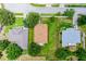 Aerial view of a single-Gathering home with a fenced backyard, surrounded by lush greenery at 1112 Spruce Ridge Ct, Minneola, FL 34715