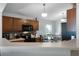 Open kitchen with wood cabinets and stainless steel appliances at 1112 Spruce Ridge Ct, Minneola, FL 34715