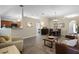 Bright, open living area featuring dining room, cozy seating, and neutral decor at 1112 Spruce Ridge Ct, Minneola, FL 34715