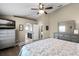 Main bedroom features a peaked ceiling, wood floor, and doorway to main bath at 1112 Spruce Ridge Ct, Minneola, FL 34715