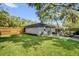 Private backyard featuring a patio, seating area, and lush lawn at 1217 Kenwood Ave, Winter Park, FL 32789