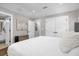 Cozy bedroom with white linens, neutral walls, and modern accents at 1217 Kenwood Ave, Winter Park, FL 32789