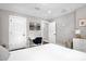 Bright bedroom with white walls, modern lighting, and an inviting, minimalist aesthetic at 1217 Kenwood Ave, Winter Park, FL 32789