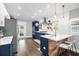 Modern kitchen featuring two-tone cabinetry, stainless steel appliances, and a stylish island at 1217 Kenwood Ave, Winter Park, FL 32789