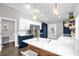 Bright kitchen showcasing white countertops, blue cabinets, and modern stainless steel appliances at 1217 Kenwood Ave, Winter Park, FL 32789