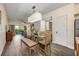 Open dining area with view of the living room and kitchen at 12527 Floridays Resort Dr # E104, Orlando, FL 32821